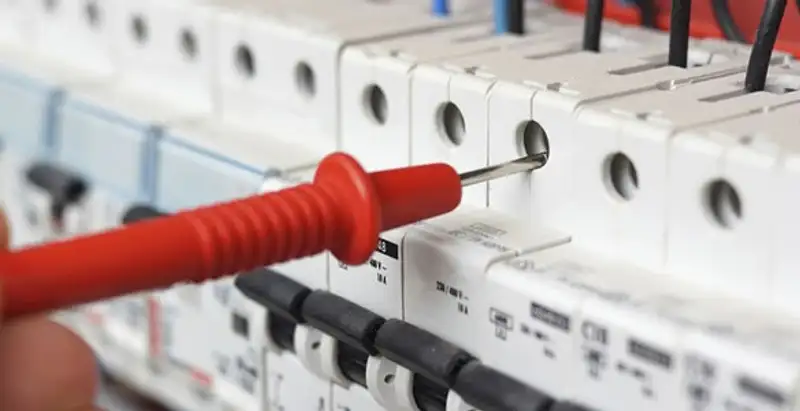 Electrical contractor testing circuit breakers during electrical repair in Phoenix, AZ