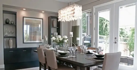 Elegant dining room chandelier installation above table in Chandler, AZ