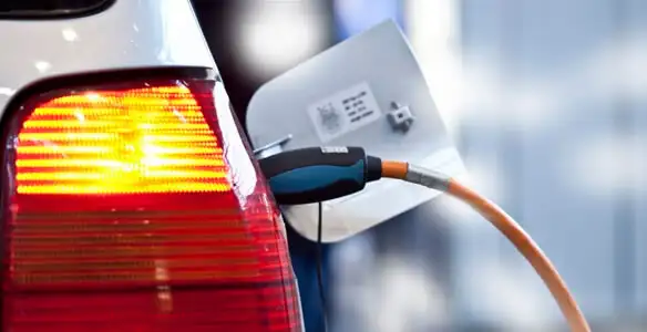 Electric car plugged into EV charger after professional installation in Chandler, AZ