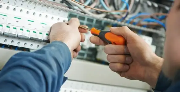 electrical service showing licensed electrician performing electrical panel maintenance and adjustments in Chandler, AZ