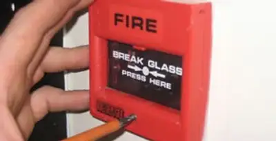 fire alarm installation service showing manual fire alarm pull station installed by licensed electricians in Chandler, AZ
