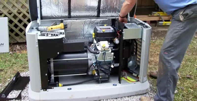 generator installation service showing technician connecting and configuring generator components in Chandler, AZ