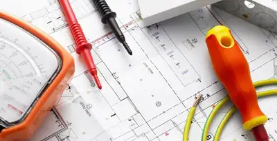 licensed electrician planning and testing electrical systems using professional tools in Chandler, AZ