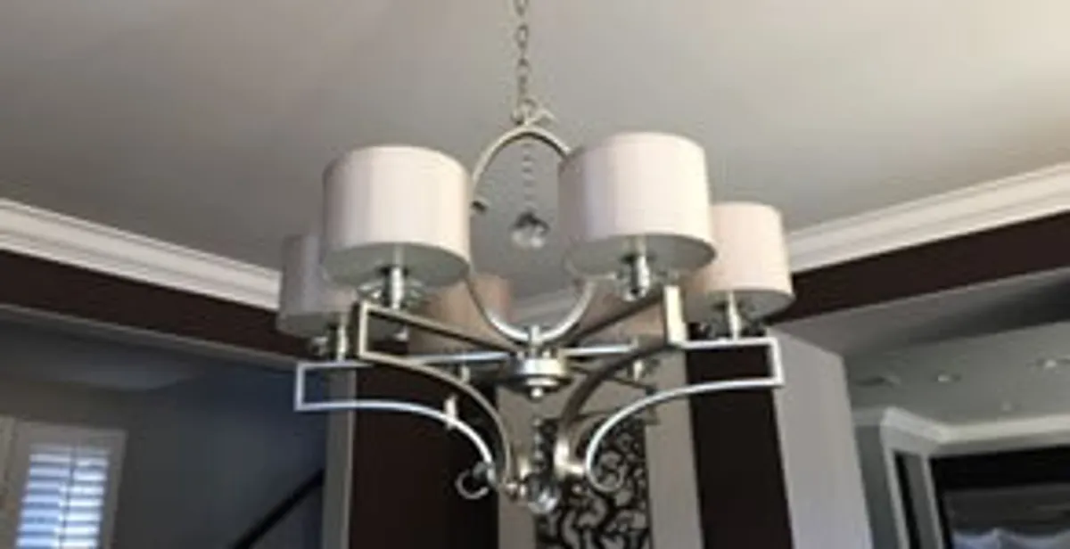 Modern chandelier installation with multiple light fixtures in Chandler, AZ