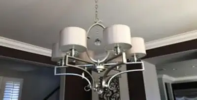 Modern chandelier installation with multiple light fixtures in Chandler, AZ