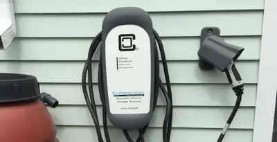 Outdoor electric vehicle charger installation on residential wall in Chandler, AZ
