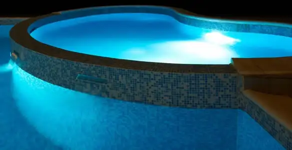 pool light installation and repair services highlighting illuminated pool interior lighting in Chandler, AZ