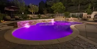 pool light installation and repair services illuminating a residential swimming pool in Chandler, AZ